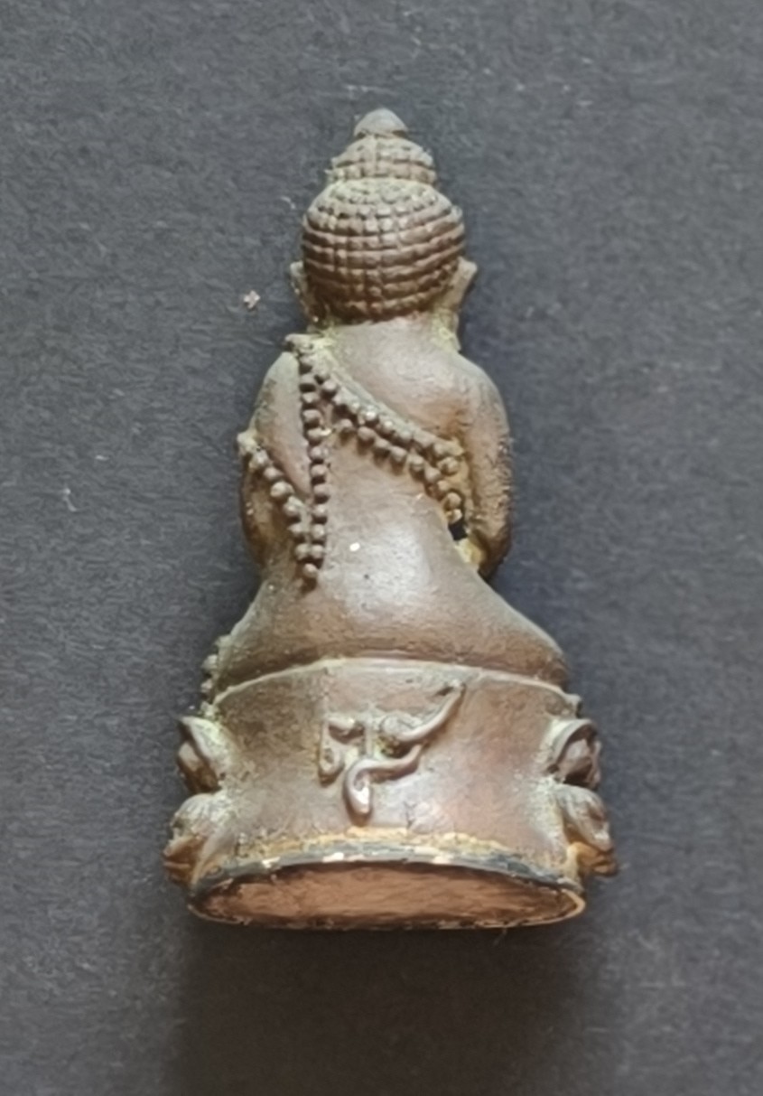 A hollow interior containing a tiny sacred metal bead that creates the distinctive "kring" sound when gently shaken